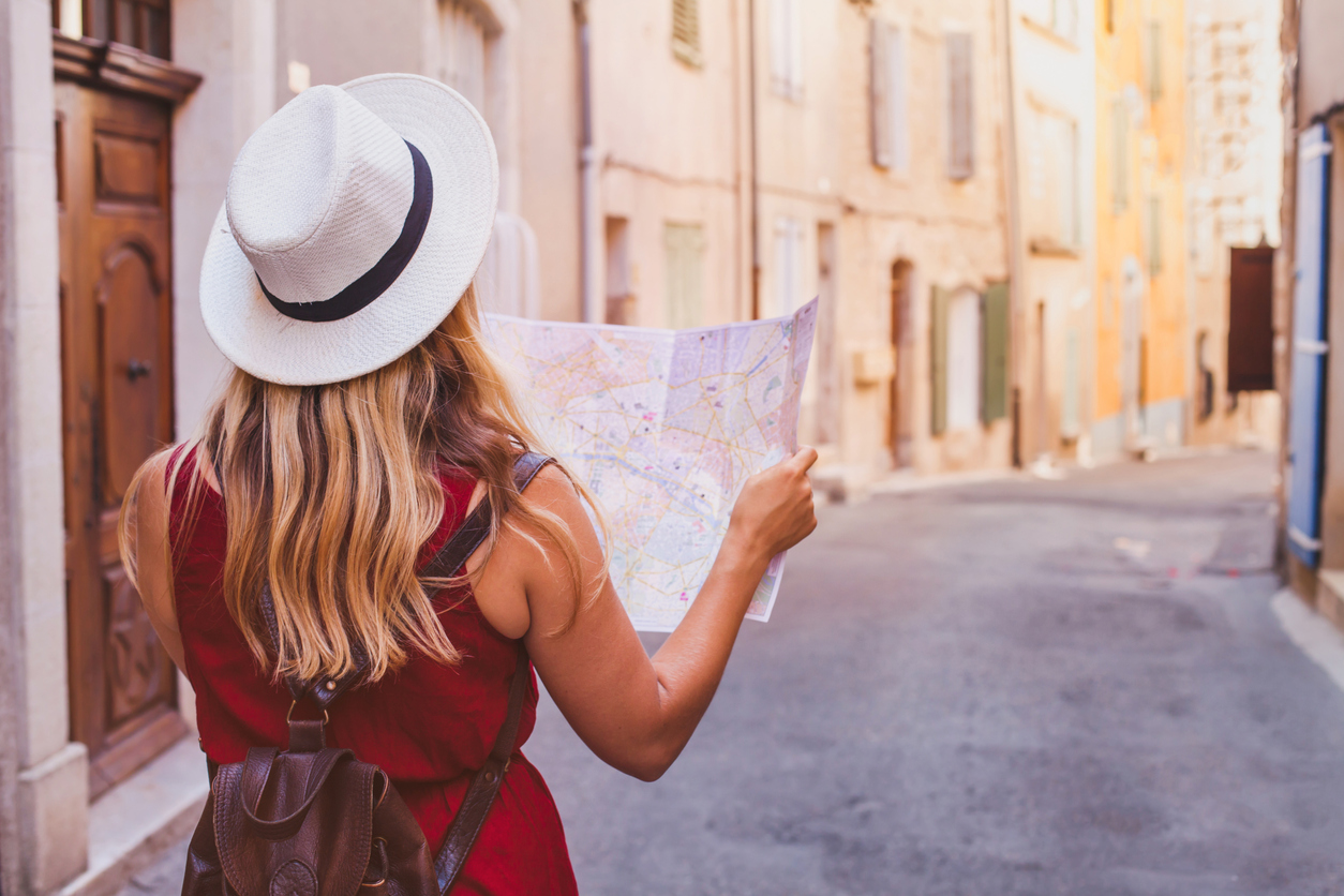 travel to Europe, tourist looking at map on the street, summer holidays sightseeing tourism